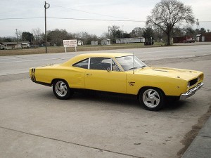 Side of yellow Dodge Superbee car