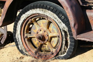 flat tire on rusted rim